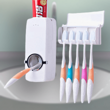 Automatisk tandpasta dispenser med tandbørsteholder